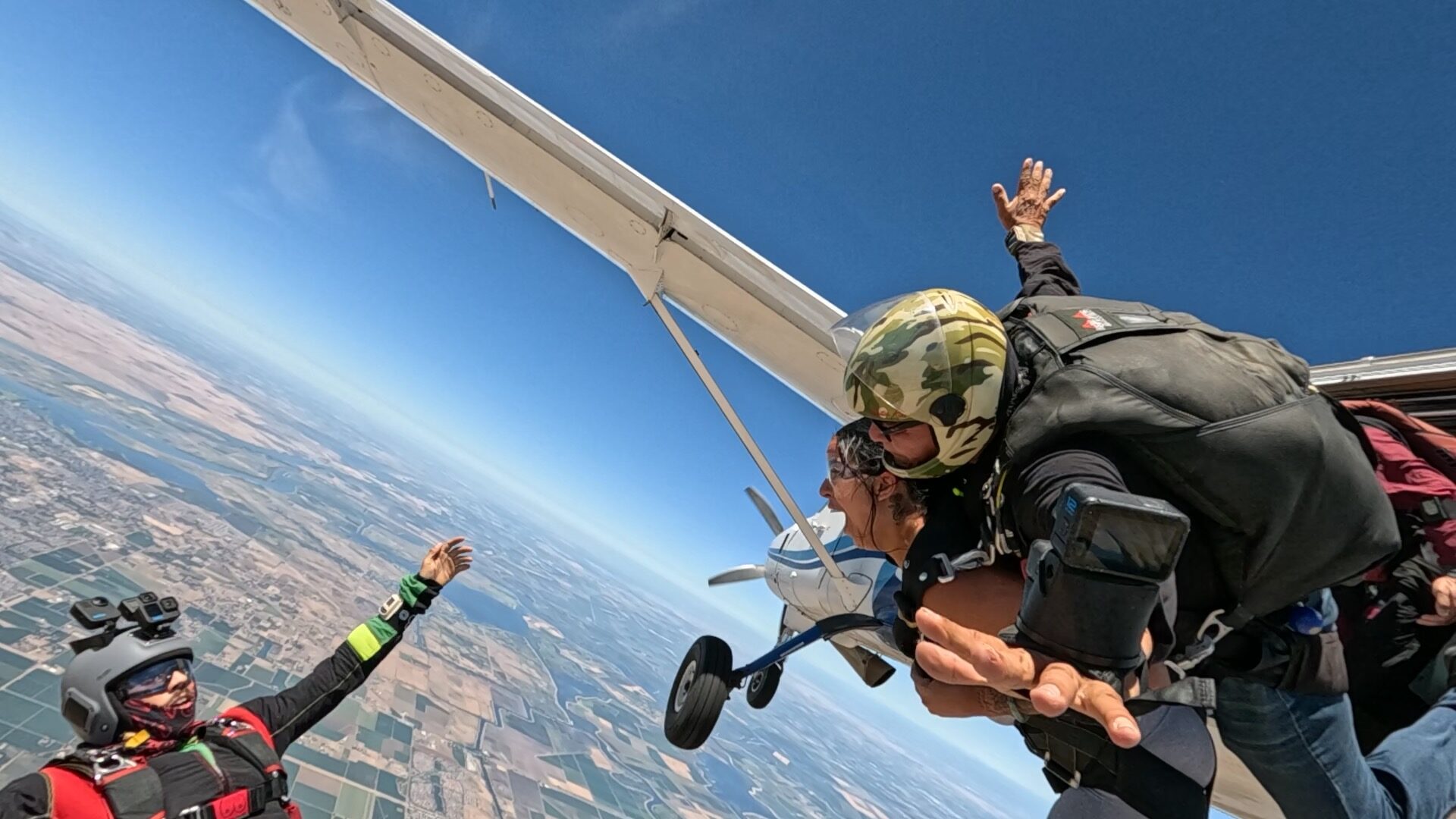 Skydiver hanging from the aircraft, room for a brand
