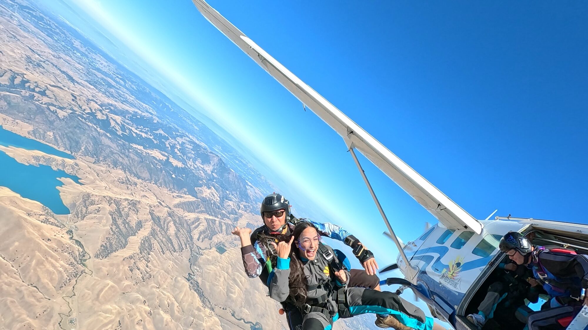 Skydiver in freefall high above the California landscape